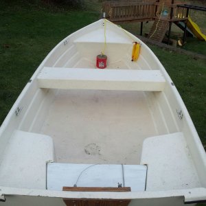 Bow and stern corner seats are sealed with foam floatation and center bench is just an upside down U of fiberglass.  Rear center board lifts out without fasteners