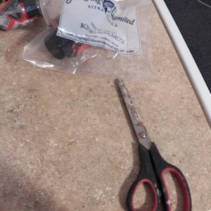 Every corner gets a little snip.  This allows the waterproof package to be immediately torn open from any position.