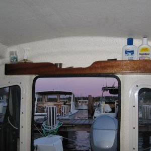 mini shelf above entry hatch for various small things used every day
clock mounted on velcro