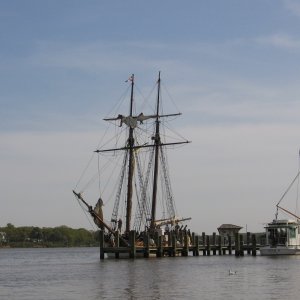 note the crew furling sails.