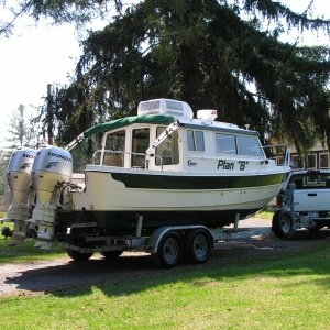 Media '' in album '(Stanley-J) After a 19 hour trip home from St. Louis. I had to cut a tree  down to get the boat in the driveway...great planning"'