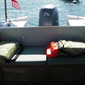 Stern cockpit seat showing bags that store life preservers, ready to go.