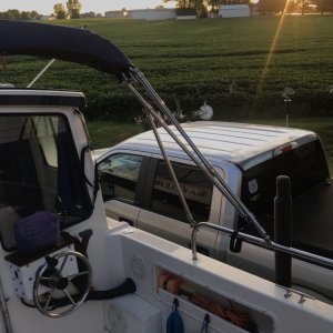 Bimini can be folded forward when on the water when trolling with the downriggers attached. Or fishing off the back of the cockpit.