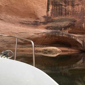 Davis Gulch just up from the arch.  The small looking overhang here is actually huge & boats can beach on either side of the center rock.  Under the overhang in the sand is large totally protected area where there are normally a group of campers.