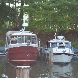 23 ft Venture next to 25 ft Ranger Tug