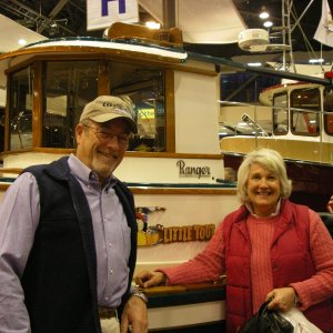 Patti and Barry (C-Cakes) standing in 
front of restored Ranger Tug SBS