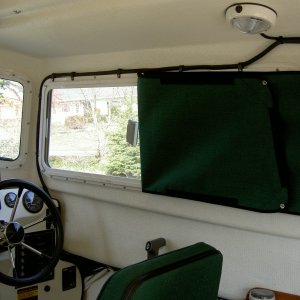 (Valkyrie) Factory window cover with extra snaps added for ventilation and privacy at night.  Double sided snaps were used.  Also snaps were added at mid-point and forward because the velcro-tape would fall off in hot weather.