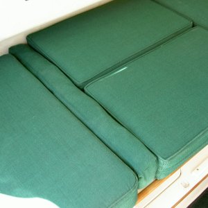 Marcia-made insert for dinette in berth mode.  Reversible passenger seat option leaves a 4 inch gap in the cushions, which makes sleeping difficult because cushions can move.  Insert keeps everything in place.