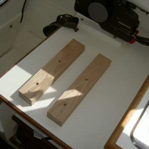 Raising the helm seat two inches.  I added oak supports and bought 4  machine screws (3", 10/24).  Drill holes in the oak supports, line up carefully and secure with screws.  Much more comfortable and better visibility, even with trim tabs.  A quick and easy project.