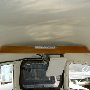 Shelf with teak fiddle for chart book storage