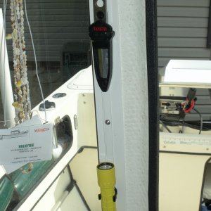 Emergency gear added near the door for quick access.  Surefire LED flashlight is mounted in 1" clips available from West Marine.  Tekna dive knife mounted above the light.  Both use screw holes in the window frame for mounting.