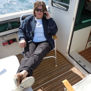 Marcia letting her folks know we're headed their way - Beaufort, SC.  Anchored for lunch in Mile Hammock Bay, NC.
