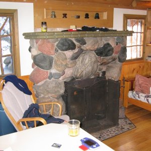 Each interior window has a handmade shutter that uses cedar branches for the "grills" in the windows.