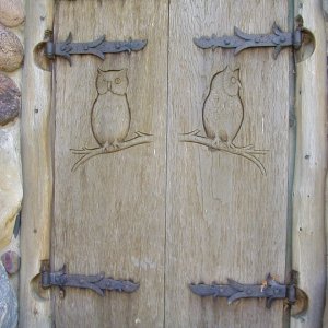 Media 'All the cedar shutters have different wildlife carvings - done by the same gentleman. He did all the work/craftsman/artist work - everything.' in album 'Winter Cottage'
