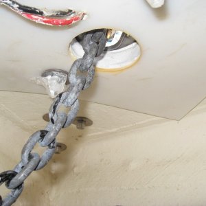 1/4 inch 12x12 UHDW plastic backing plate windlass load is in shear so maybe overkill but maybe not.  lewmar provides 3/8 washers, not even fender washers