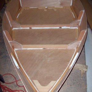Media 'You can see laying on the floor of the dinghy I have cut the breast hook, remaining seat risers, transom knees, and quarter knees (but not yet installed).  These items require a lot of patience with careful sanding to get everything to fit snug.' in album 'Dec 2010 New Dinghy Project(1)'