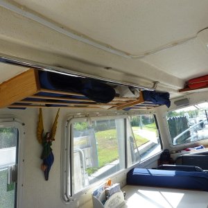 Media 'Serves well for light materials such as window covers and screens.' in album 'Overhead storage glued to ceiling.'