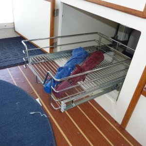 Under dinette seat pull out storage.  Area along sides used for taller items.