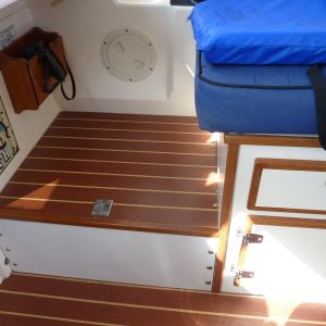 Media 'Storage area under the raised deck at the front of the helm seat.  Easy access for navigational items.' in album 'Overhead storage glued to ceiling.'