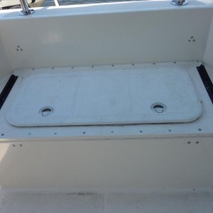 Media 'Former live well converted to storage.  Replaced top with watertight hatch.' in album 'Overhead storage glued to ceiling.'
