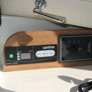 Mount for charger remote and BlueSea 7600 ACR control.