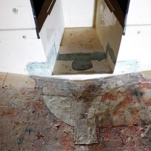 Section of bulkhead has been replaced. The light green substance is fairing compound that was laid over the fiberglass. Next up, lay down a new fiberglass top skin on the cabin floor!