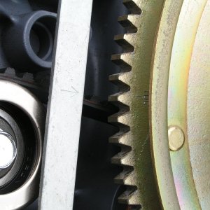 Flywheel aligned to its mark (which results in the cam sprockets off by 1 notch -- next picture).