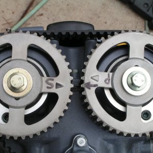 This shows the alignment of the cam sprockets when the flywheel shaft notch is aligned with its "visible" mark with the flywheel "in place" -- makes a difference.