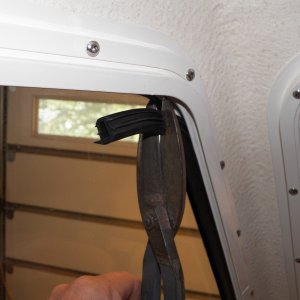 Media 'I pulled out the rubber "stopper" material and shortened it a couple of inches top and bottom using tin snips.' in album 'My windows didn't open enough to comfortably hang my elbow out while at the helm.'
