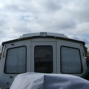 teak single loop handles on sides and back brow