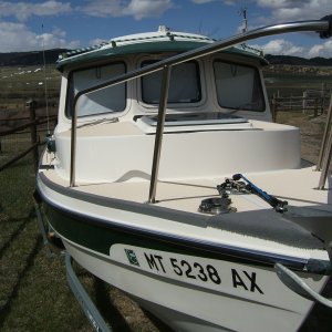 Media 'view of 3-M non skid on gunwale and carpet to cushion knees when anchoring' in album 'custom drawer and separated storage below front seat'