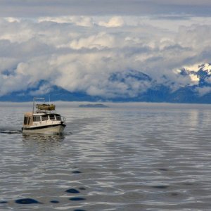Our little boat seems so small on these big Alaska waters.