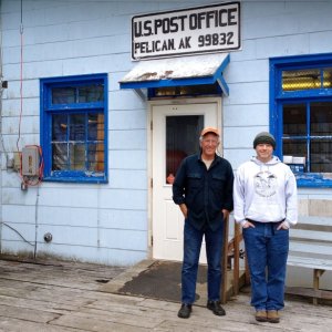 Casey with John, the postmaster at Pelican