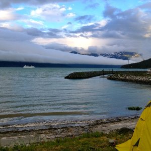 The clouds have been low and very fast moving in Haines.  The cruise ship shows the perspective of just how big and thick that low lying cloud was.