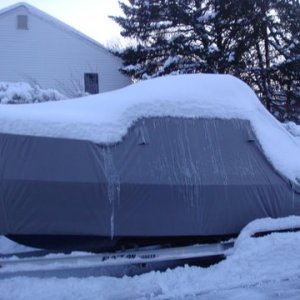 Media 'Winter 2010 over 70 inches of snow so far this year we are ahead of Buffalo for total inches of snow. The cover is doing a fine job. Heater inside the boat is keeping it toasty on the inside.' in album 'Ginny, checking the inside of the boat which we keep shore power plugged in battery charger on running small electric heater on low'