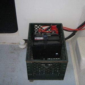 Battery box inside crate.  Shim under inboard side of crate to level.