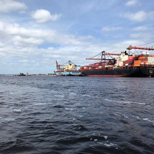 Tugs getting ready to move this ship off the dock.
