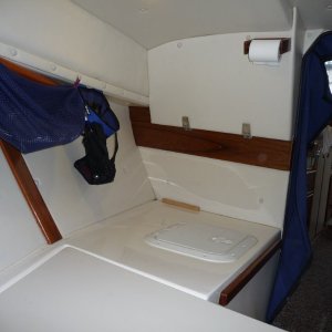 Aft to Starboard.
Access cover to back of Helm.