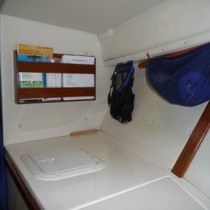 Media 'Aft to Port.' in album 'Cutty, Forward to Port.
Wooden boat paddle held up under port forward deck.
Access hatch to storage locker.'