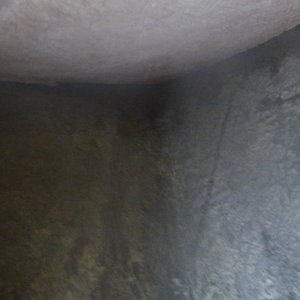 looking from within the hole, forward at the stem, and under the anchor locker.