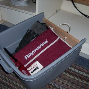 helm storage - had to modify this one to fit. There is a little more storage underneath the shelf that this tote sits on.