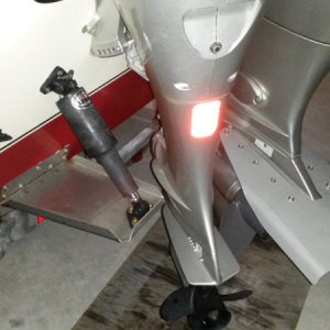 Kicker mounted to transom full lock port. 5/8" clearance from Lenco trim tab.