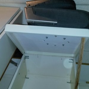 Storage box lid is mounted on hinges and much easier to access.
