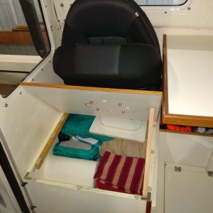 Rear seat storage. I removed shelf above water tank to open up more room. We keep soft items here and has a fair amount of space above tank.