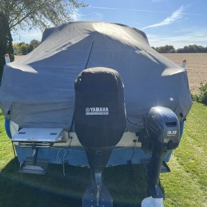 Boat cover, stern view.  Zipper door for entry without removing cover.