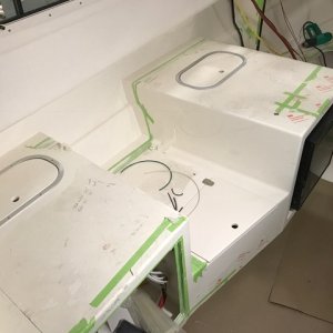 Storage behind the water heater and fridge.