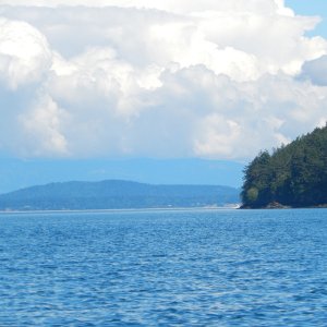 Islands, clouds, and blue water