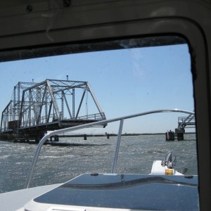Not much traffic so this bridge is mostly manual. The tender had to walk to both ends and close the gates. Then walk to the shed in the center and operate the motor to open.