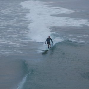 Kids surfing by Surf CityPier