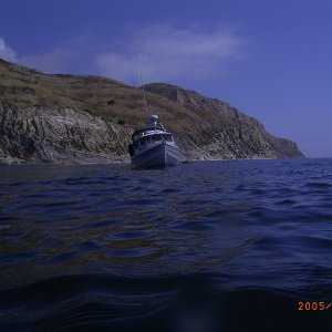 Fishtales at anchor near sandstone cliffs of Santa Cruz Island
